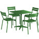 A Lancaster Table & Seating green table with chairs and umbrella hole on an outdoor patio.