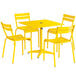 A yellow table and chairs set on an outdoor patio.
