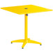 A yellow square Lancaster Table & Seating outdoor table with a black umbrella hole.
