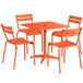An orange Lancaster Table & Seating outdoor table with four chairs.