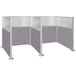 A Versare Hush Panel double cubicle with grey fabric walls.