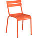 An orange powder-coated aluminum table with an umbrella hole and two orange powder-coated aluminum chairs.