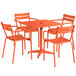 A Lancaster Table & Seating orange powder-coated metal table and chair set on an outdoor patio.