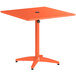 An orange square Lancaster Table & Seating outdoor table with a metal base.