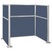 A Versare Hush Panel U-Shape cubicle with blue fabric panels and a silver metal frame.
