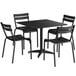 A black rectangular Lancaster Table and Seating outdoor table with four black chairs around it.