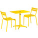A Lancaster Table & Seating yellow table and two chairs.