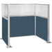 A Versare Hush Panel Caribbean U-Shape cubicle with a white wall and blue fabric.