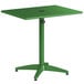 A green Lancaster Table & Seating outdoor table with a black metal base.