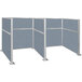 A Versare powder blue H/W-shape double cubicle with white frame.