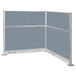 A Versare Hush Panel L-Shape cubicle with blue and gray partitions and metal frame.