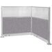 A Versare Hush Panel L-shaped cubicle with grey fabric.