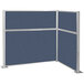 A blue Versare Hush Panel L-shaped cubicle with silver corners.