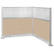 A beige and white L-shaped Versare cubicle with a beige panel and window.