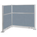 A Versare powder blue and gray L-shaped cubicle partition with metal frame.
