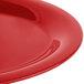 A close-up of a shiny red Carlisle Sierrus melamine platter.