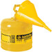 A Justrite yellow steel diesel safety can with a yellow funnel.
