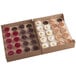 A box of White Toque mini assorted dessert cups with different colored round containers containing desserts.