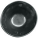 A black irregular round melamine bowl with a white background.