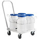 An aluminum dolly with four white Choice ice totes.