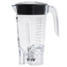 A clear plastic Hamilton Beach blender container with a black handle and lid.