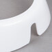 A close up of a white plastic Tablecraft salad dressing dispenser collar with maroon lettering.