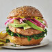 A Good Catch plant-based salmon burger with vegetables on a plate.