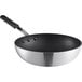 An Emperor's Select aluminum non-stick stir fry pan with a black silicone handle.