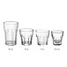 A set of four Acopa Memphis 14 oz. Beverage Glasses with curved edges.