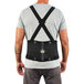 A man wearing an Ergodyne ProFlex 2000SF black back support belt.