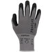 A close-up of a grey and black Ergodyne ProFlex warehouse glove.