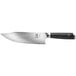 A Mercer Culinary Damascus chef knife with a black handle and silver blade.