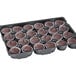 A tray of Rich's Allen un-iced chocolate cupcakes in plastic wrappers.