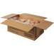 A cardboard box with Rich's Unfilled Long John Yeast Donuts inside.