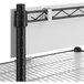 A Regency black metal mobile shelving station with 5 shelves and a white PVC overlay.