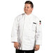 A man in a Uncommon Chef white long sleeve chef coat.