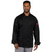 A man wearing a black Uncommon Chef long sleeve chef coat with a mesh back.