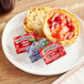 Smucker's Concord Grape Jelly, Apple Jelly, and Strawberry Jam 0.5 oz. Portion Cups - 200/Case Main Thumbnail 1