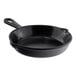 A black skillet with a handle.