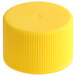 A 24/410 yellow plastic bottle cap with ribbed sides.