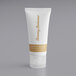 A white Tommy Bahama body lotion tube with gold text.