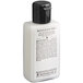 A white bottle of Beekman 1802 body lotion with a black lid and black text.