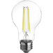 A close-up of a TCP clear filament LED light bulb shining yellow.