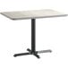 A Lancaster Table & Seating rectangular table with a white laminated top and black base.