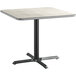 A Lancaster Table & Seating square table with a white and grey reversible top on a black base.