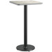 A white and gray table top with a black base pole.
