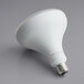 A TCP Elite dimmable LED light bulb with a white surface and a white light bulb.