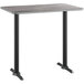 A Lancaster Table & Seating rectangular table with a reversible gray and white laminated surface and black base.