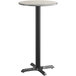 A Lancaster Table & Seating bar height table with a black base and a reversible gray and white top.