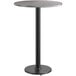 A Lancaster Table & Seating reversible gray and white laminated bar height table with a black metal base with a round bottom.